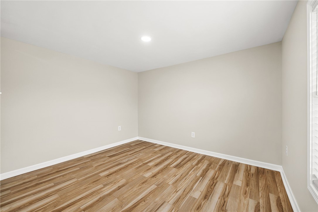 139 Davis Road Easley, SC 29640 - Photo 20 of 34 Bright and airy room featuring durable wood flooring and ample natural light.