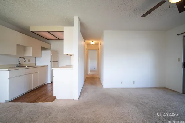 a view of a kitchen cabinets and a bed