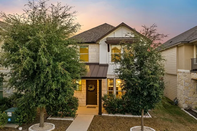 a aerial view of a house with a swimming pool