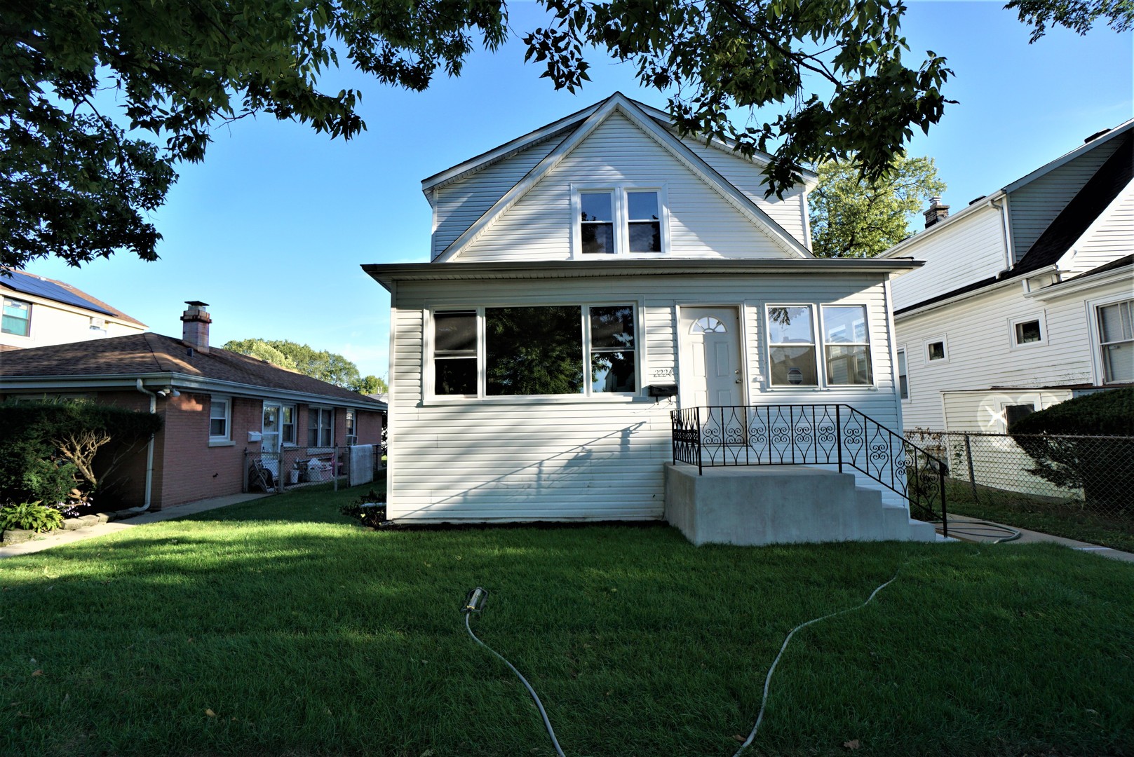 2224 Foster Street Evanston, IL 60201 - Photo 1 of 39 a view of a house with a yard and a garden