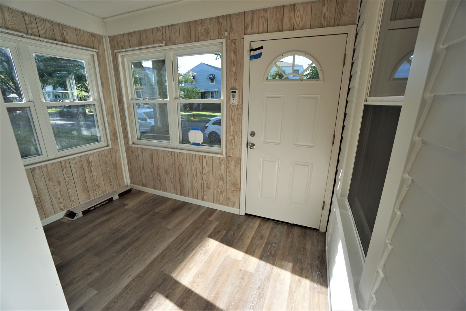 2224 Foster Street Evanston, IL 60201 - Photo 2 of 39 an entryway with wooden floor and windows