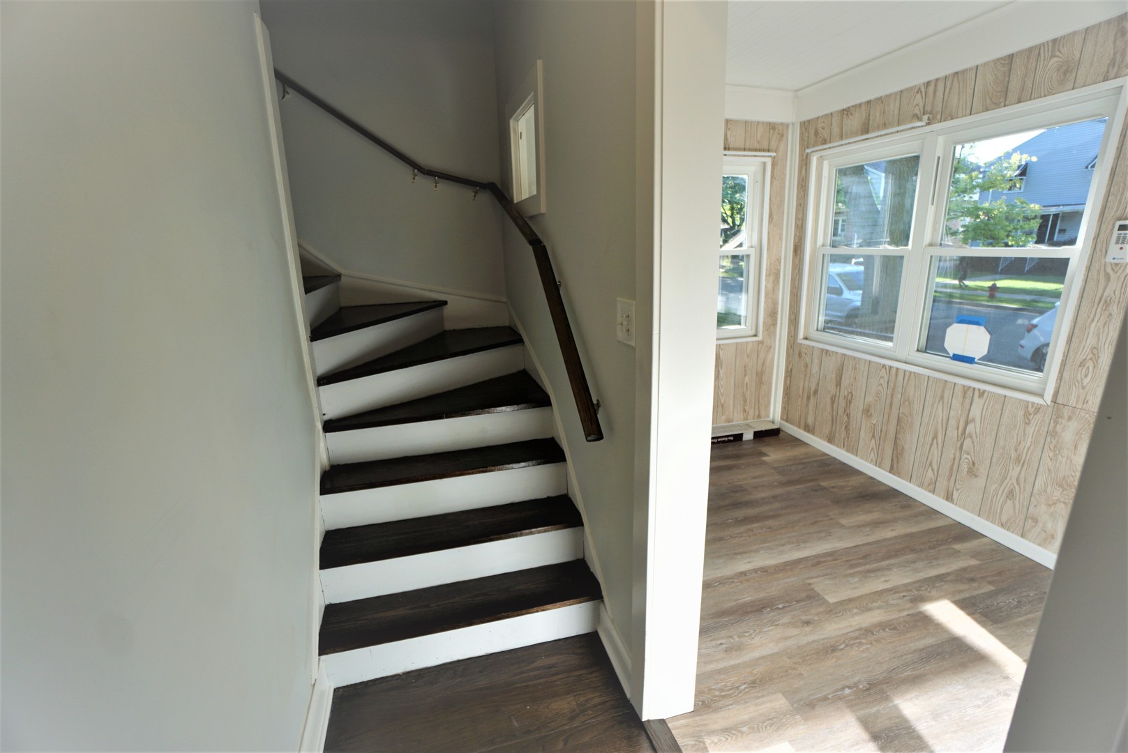 2224 Foster Street Evanston, IL 60201 - Photo 17 of 39 a view of entryway with stairs and wooden floor