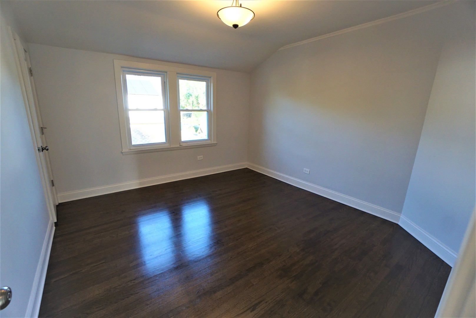 2224 Foster Street Evanston, IL 60201 - Photo 20 of 39 an empty room with wooden floor and windows