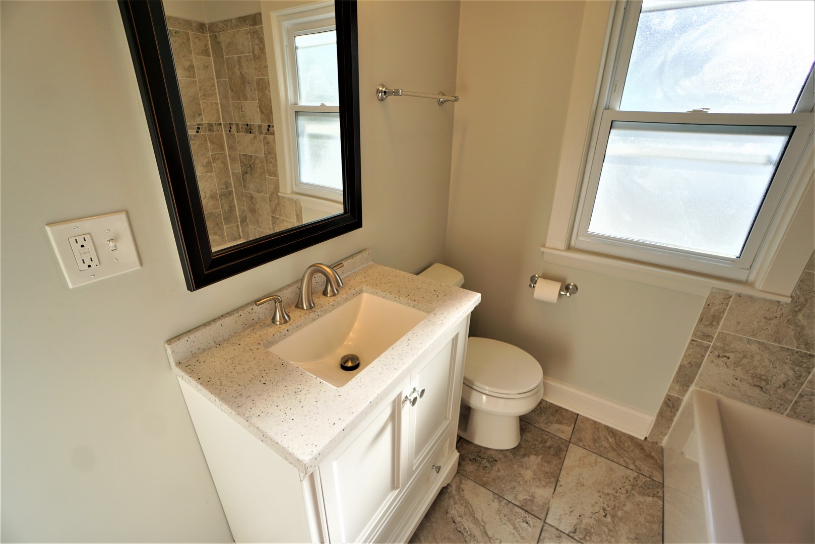 2224 Foster Street Evanston, IL 60201 - Photo 24 of 39 a bathroom with a sink and a toilet