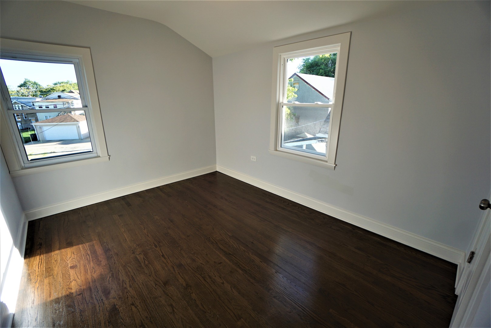2224 Foster Street Evanston, IL 60201 - Photo 26 of 39 a view of an empty room with wooden floor and a window