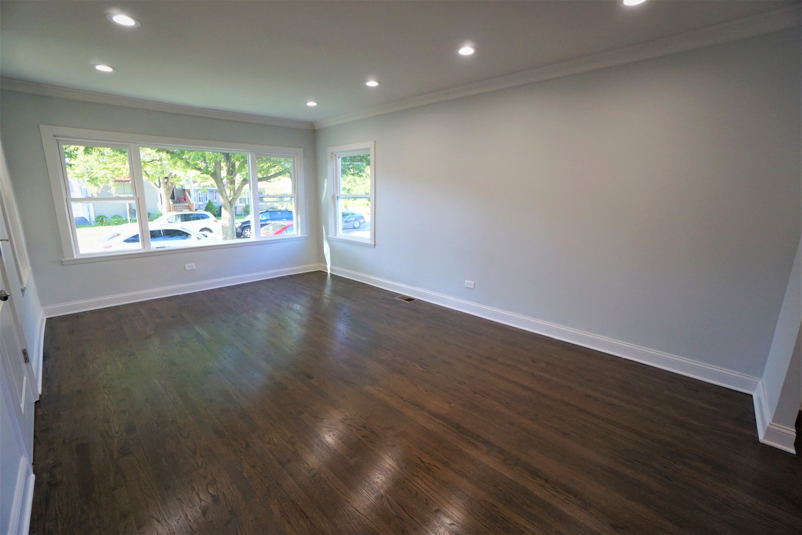 2224 Foster Street Evanston, IL 60201 - Photo 4 of 39 an empty room with wooden floor and windows