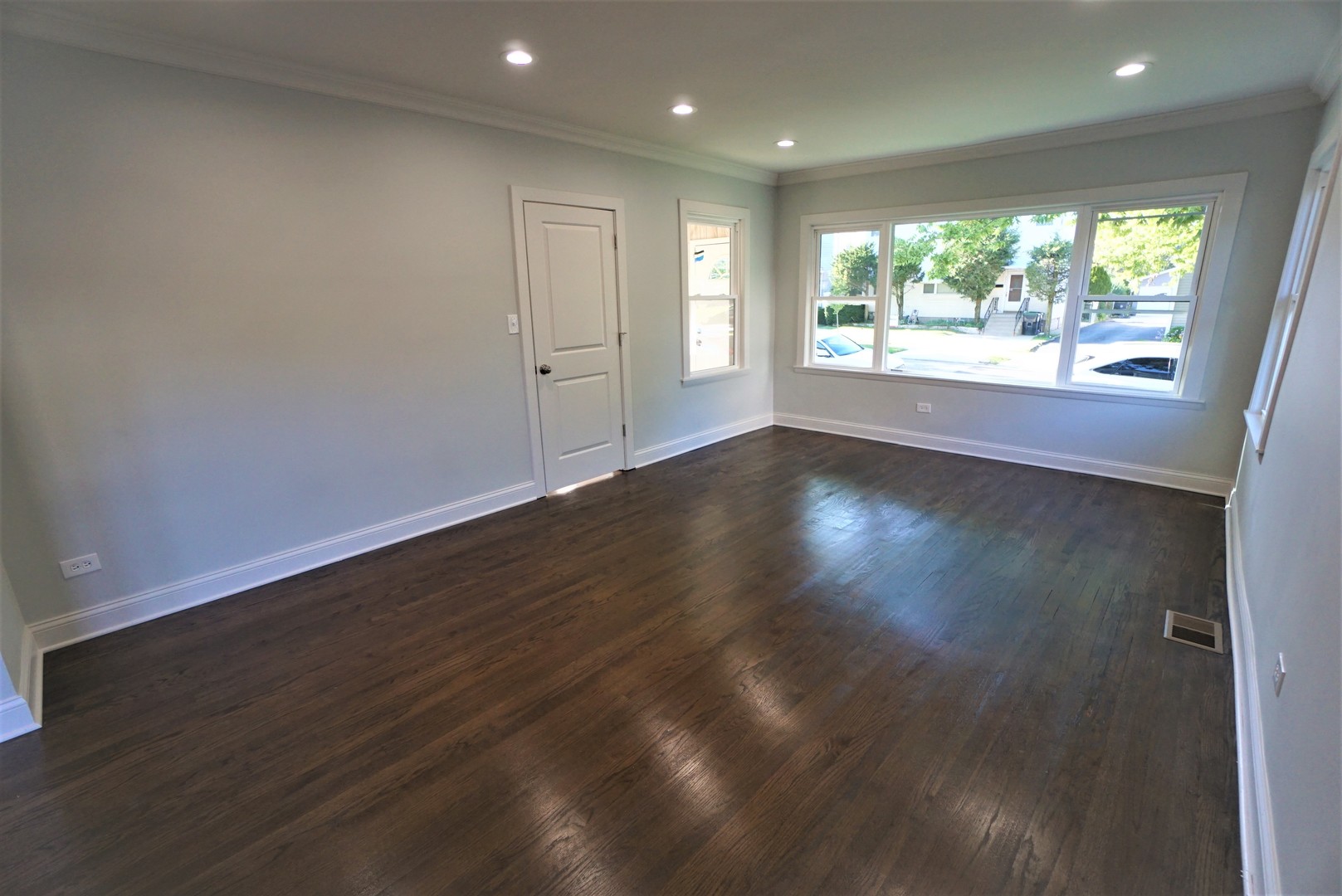 2224 Foster Street Evanston, IL 60201 - Photo 5 of 39 an empty room with wooden floor and windows