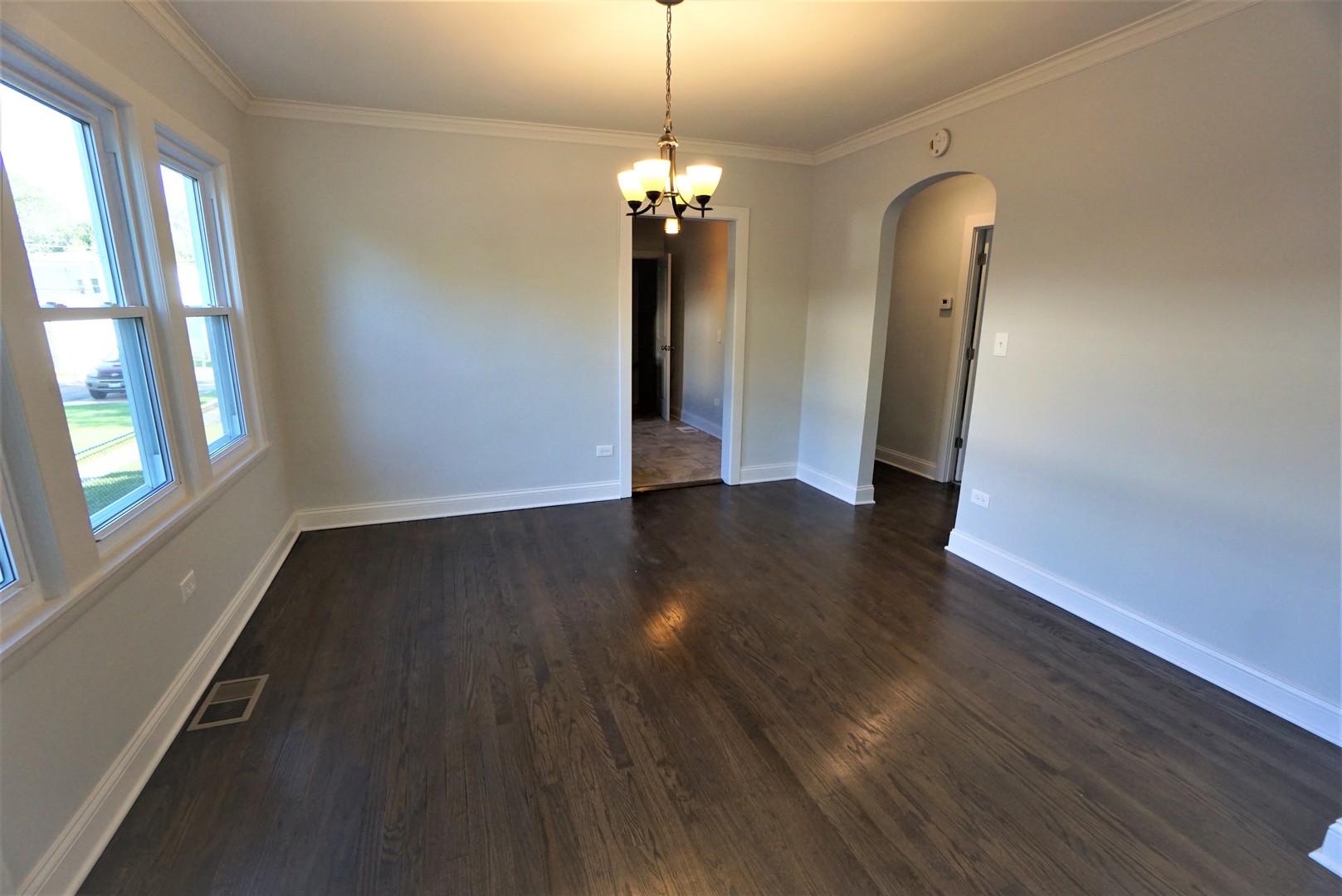2224 Foster Street Evanston, IL 60201 - Photo 6 of 39 a view of a room with wooden floor and windows