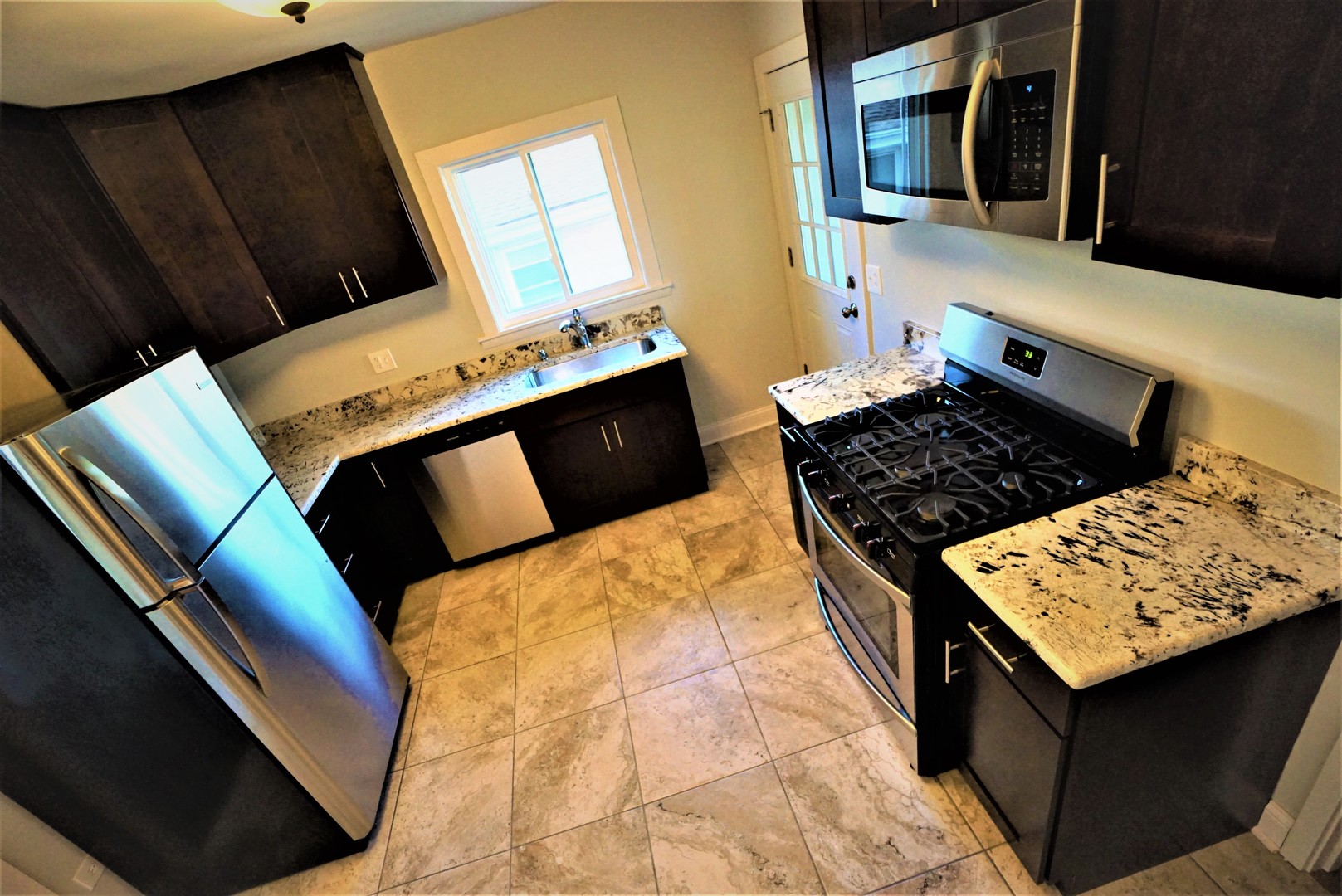 2224 Foster Street Evanston, IL 60201 - Photo 9 of 39 a bedroom with bed and wooden floor