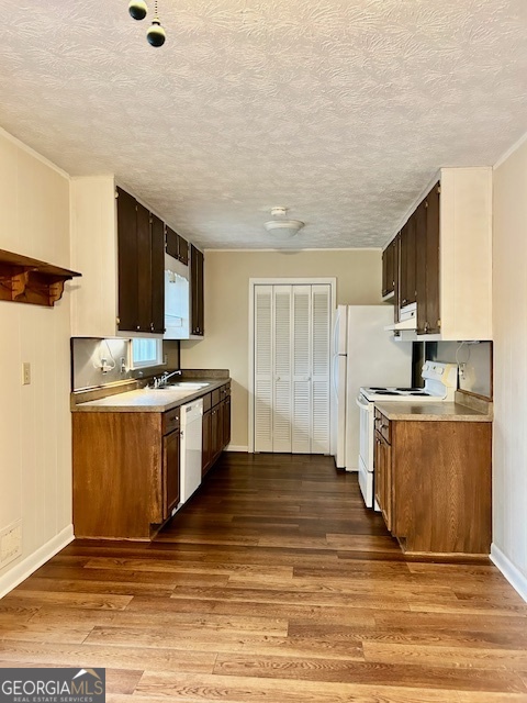 1366 Zebulon Road Griffin, GA 30224 - Photo 4 of 12 a kitchen with stainless steel appliances granite countertop a stove a sink and a refrigerator