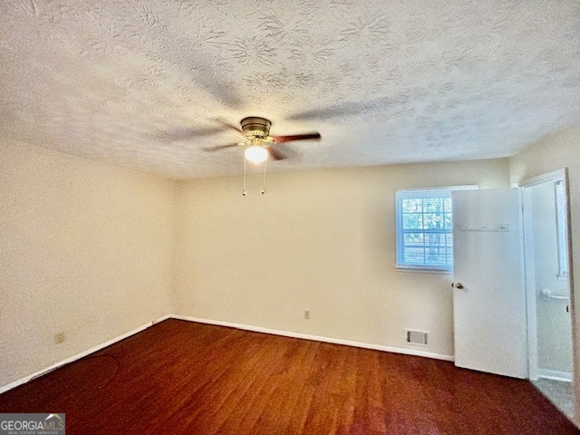 1366 Zebulon Road Griffin, GA 30224 - Photo 8 of 12 a view of an empty room with wooden floor