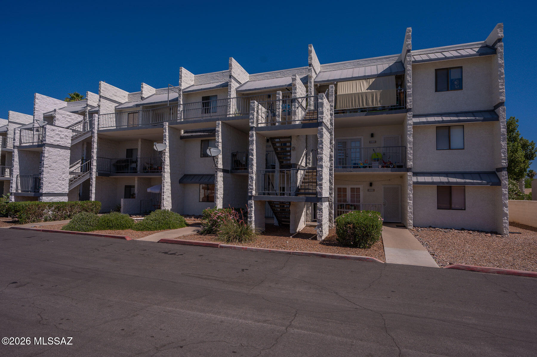 7777 East Golf Links Road, Unit 2308 Tucson, AZ 85730 - Photo 37 of 37 a front view of a building with a street