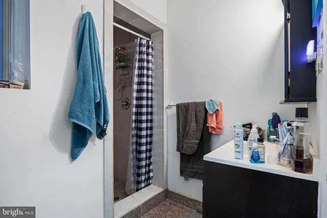 a bathroom with a sink and mirror