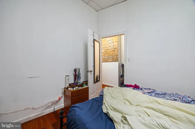 a bed room with a bed and a window