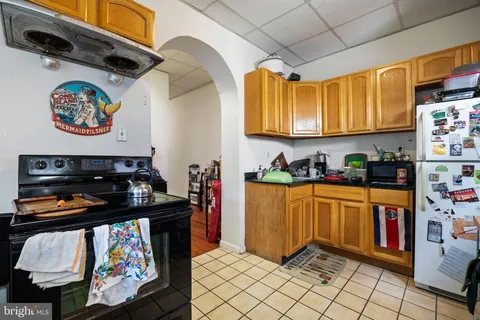 a building outdoor space with patio furniture and potted plants