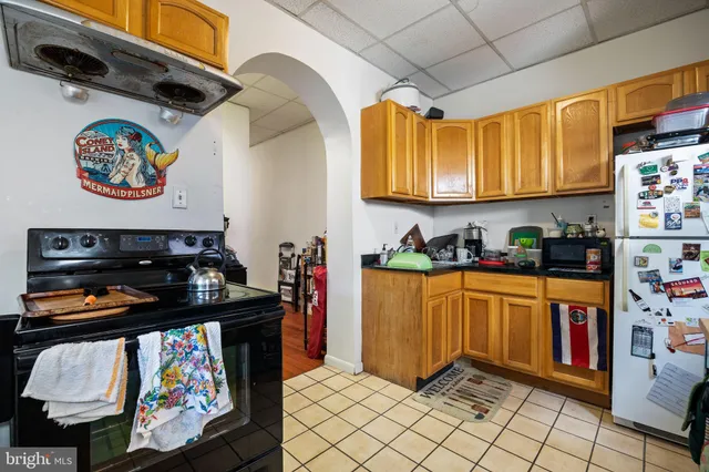 a building outdoor space with patio furniture and potted plants