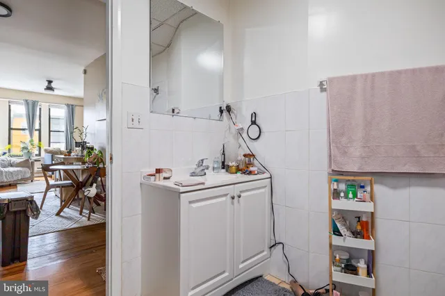 a bedroom with furniture and a wooden floor