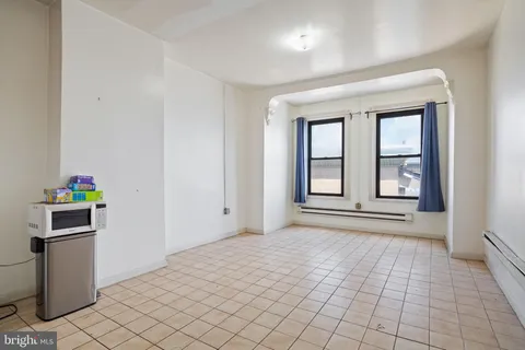 a kitchen with stainless steel appliances a refrigerator sink and cabinets