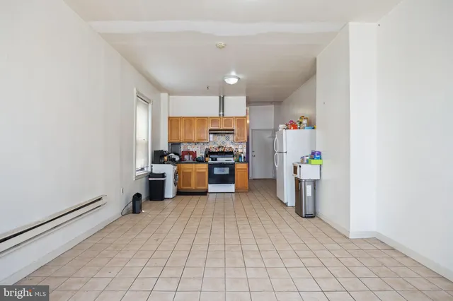 a bedroom with a bed and windows