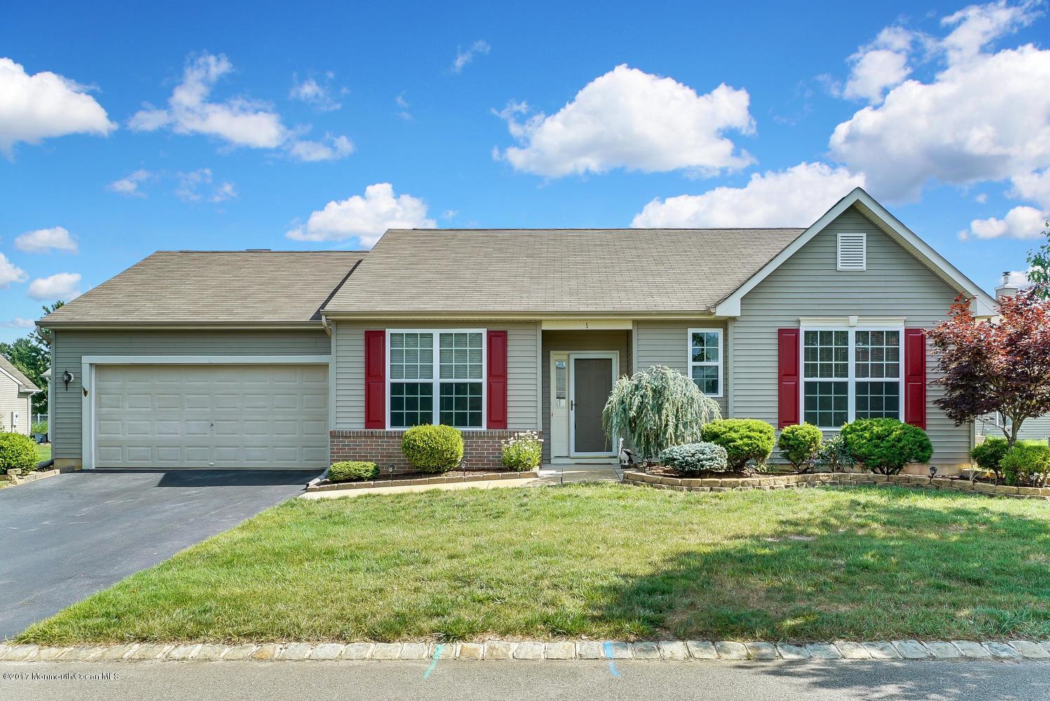 5 Carriage Road Whiting, NJ 08759 - Photo 3 of 24 a front view of a house with a yard and potted plants