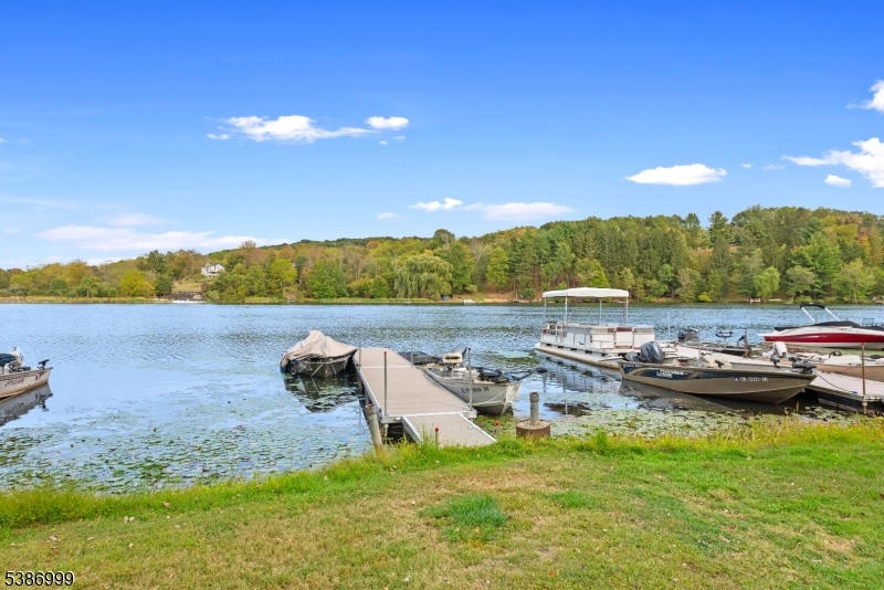 21 Lake Road Newton, NJ 07860 - Photo 13 of 18 a view of a lake with houses in the back