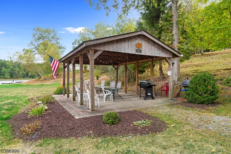 21 Lake Road Newton, NJ 07860 - Photo 16 of 18 a view of a chair and table in backyard of the house