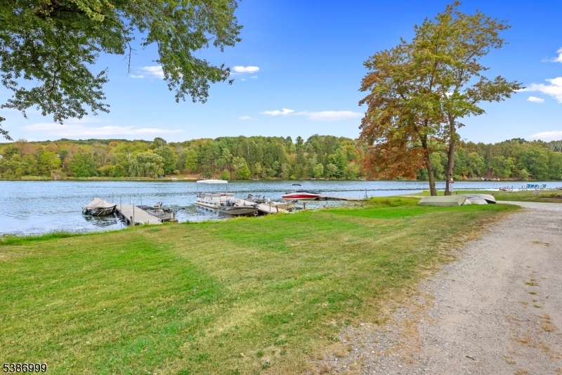 21 Lake Road Newton, NJ 07860 - Photo 17 of 18 a view of yard with large tree and wooden fence
