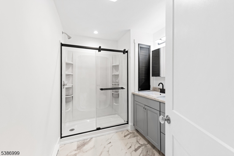 21 Lake Road Newton, NJ 07860 - Photo 6 of 18 a bathroom with a shower and a sink