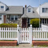a front view of a house with a porch
