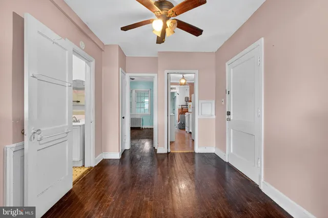 a view of livingroom with hardwood floor and a ceiling fan