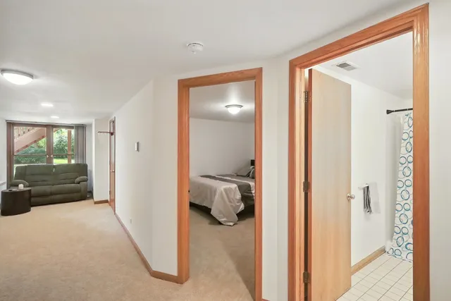 a view of hallway with livingroom and furniture