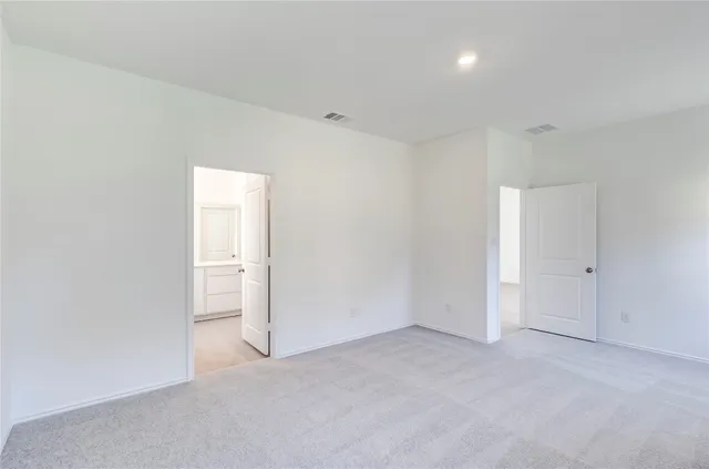 an empty room with closet area