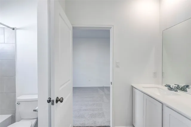 a bathroom with a sink and vanity