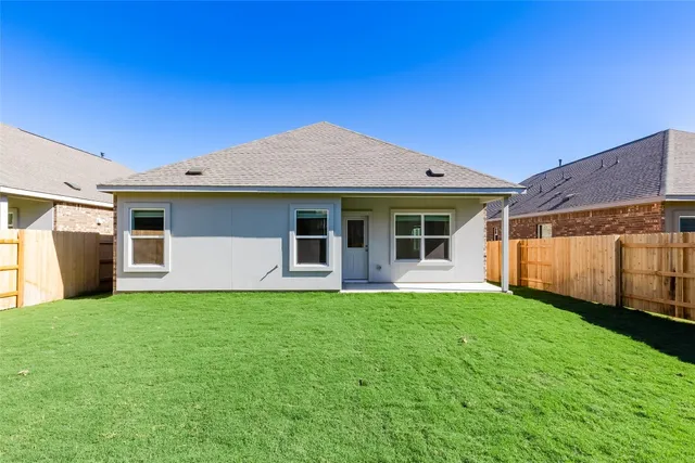 a front view of a house with yard