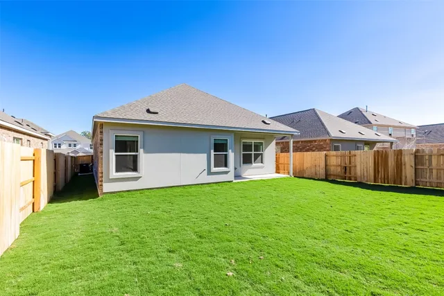 a front view of a house with yard
