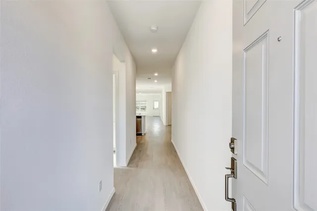 a view of a hallway with a white walls