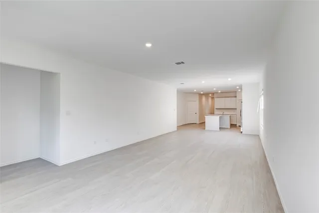 a view of a livingroom with a kitchen