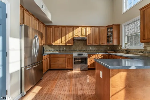 a bathroom with a tub a sink and mirror