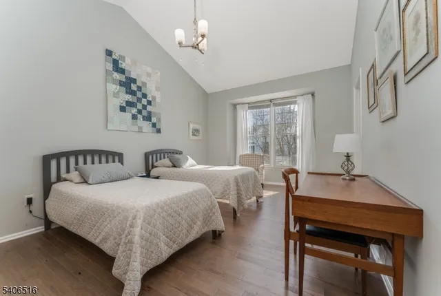 a spacious bathroom with a double vanity sink a mirror and a shower