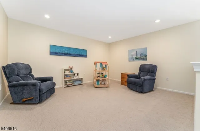 a front view of a house with outdoor seating