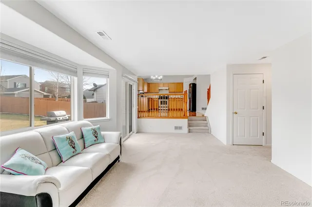a living room with furniture and window