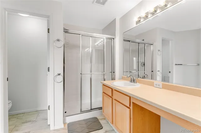 a bathroom with a sink double vanity and a mirror