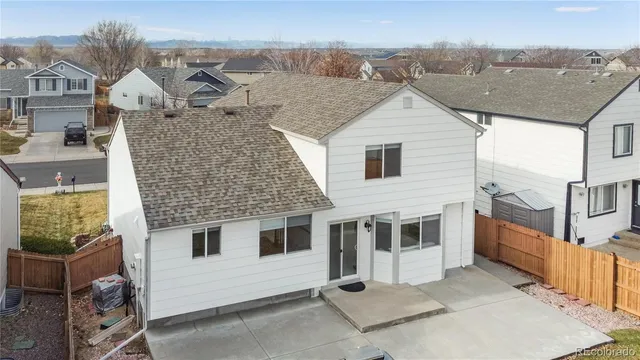 a aerial view of a house with a yard