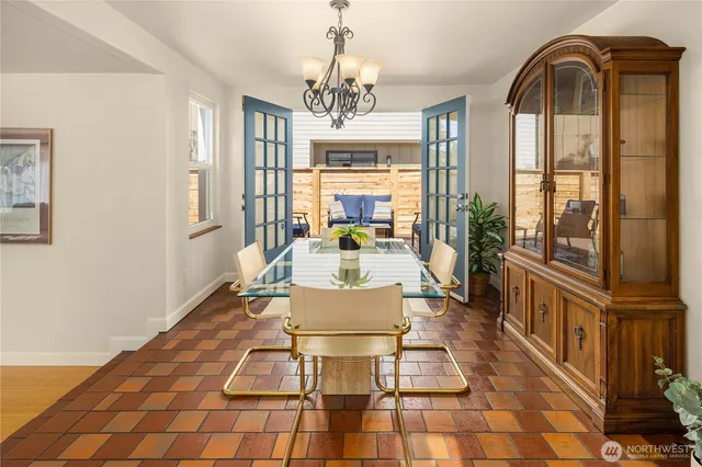 a very nice looking dining room with a large window