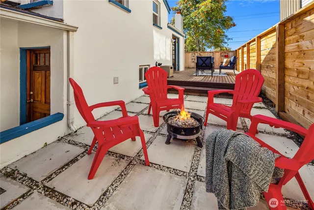 a view of a chairs and tables in the balcony