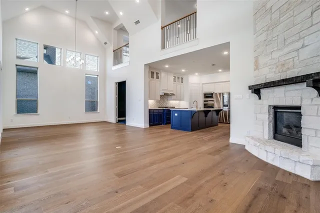 a view of a room with kitchen and fireplace