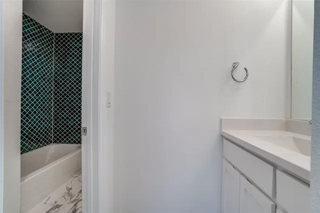 a bathroom with a sink and a bathtub