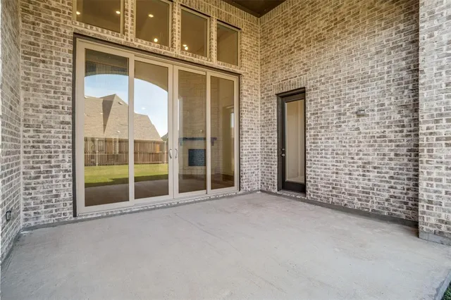a view of an empty room with a balcony