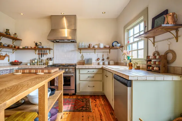 a kitchen with a stove and a sink