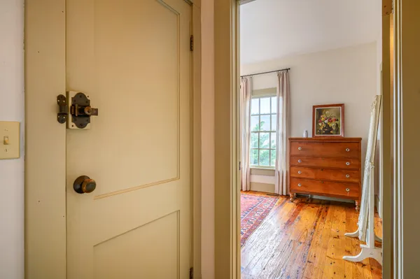 a view of a room with furniture and window